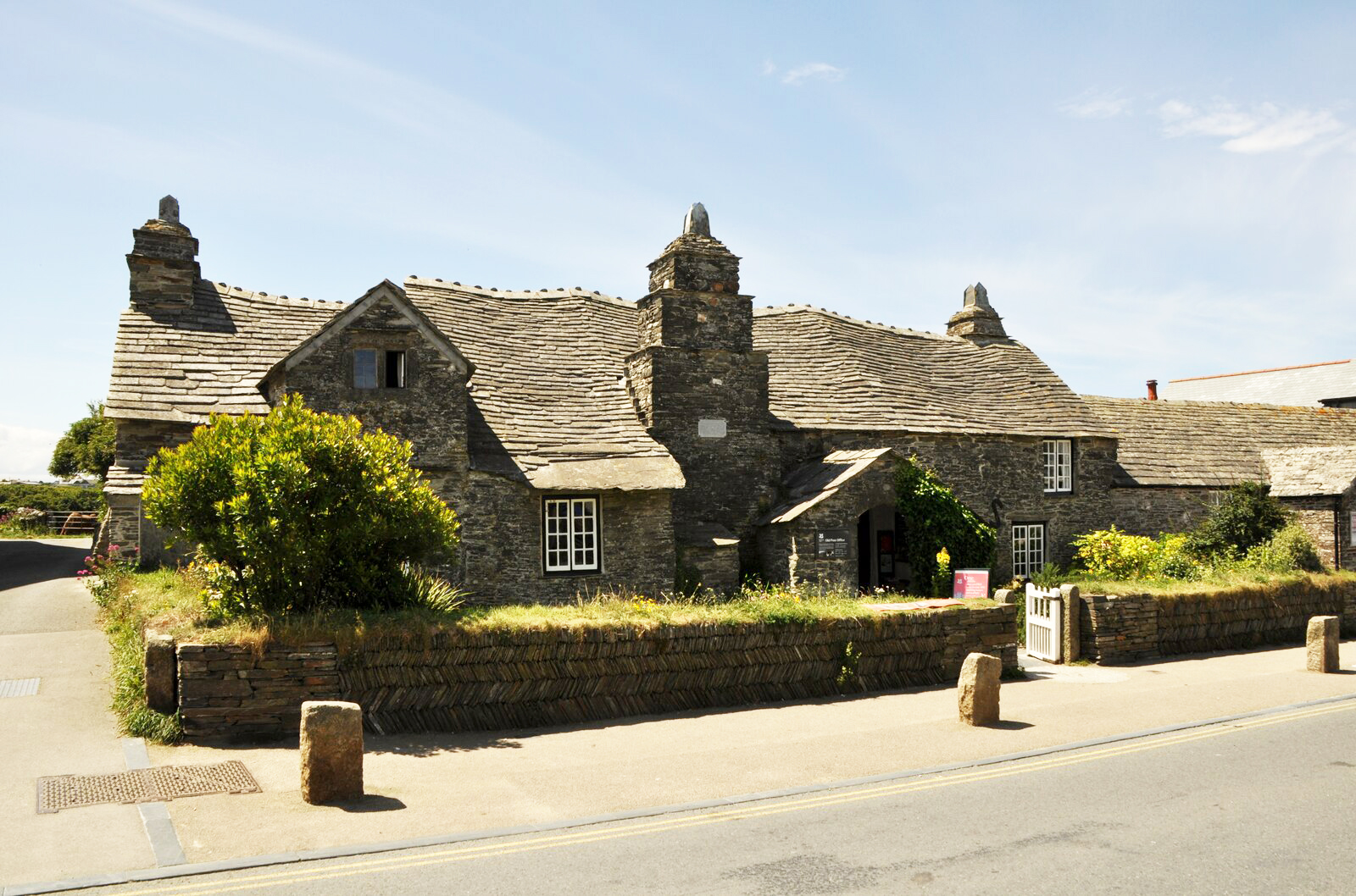 Tintagel Old Post Office with its wavy slate roof, on Fore Street