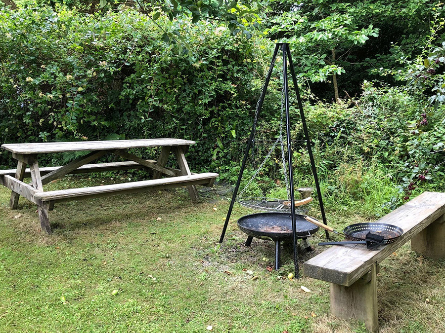 utside Picmic area and Tripod barbeque  at Foxys Shepherd Hut Glamping Self-catering between St Ives and Penzance