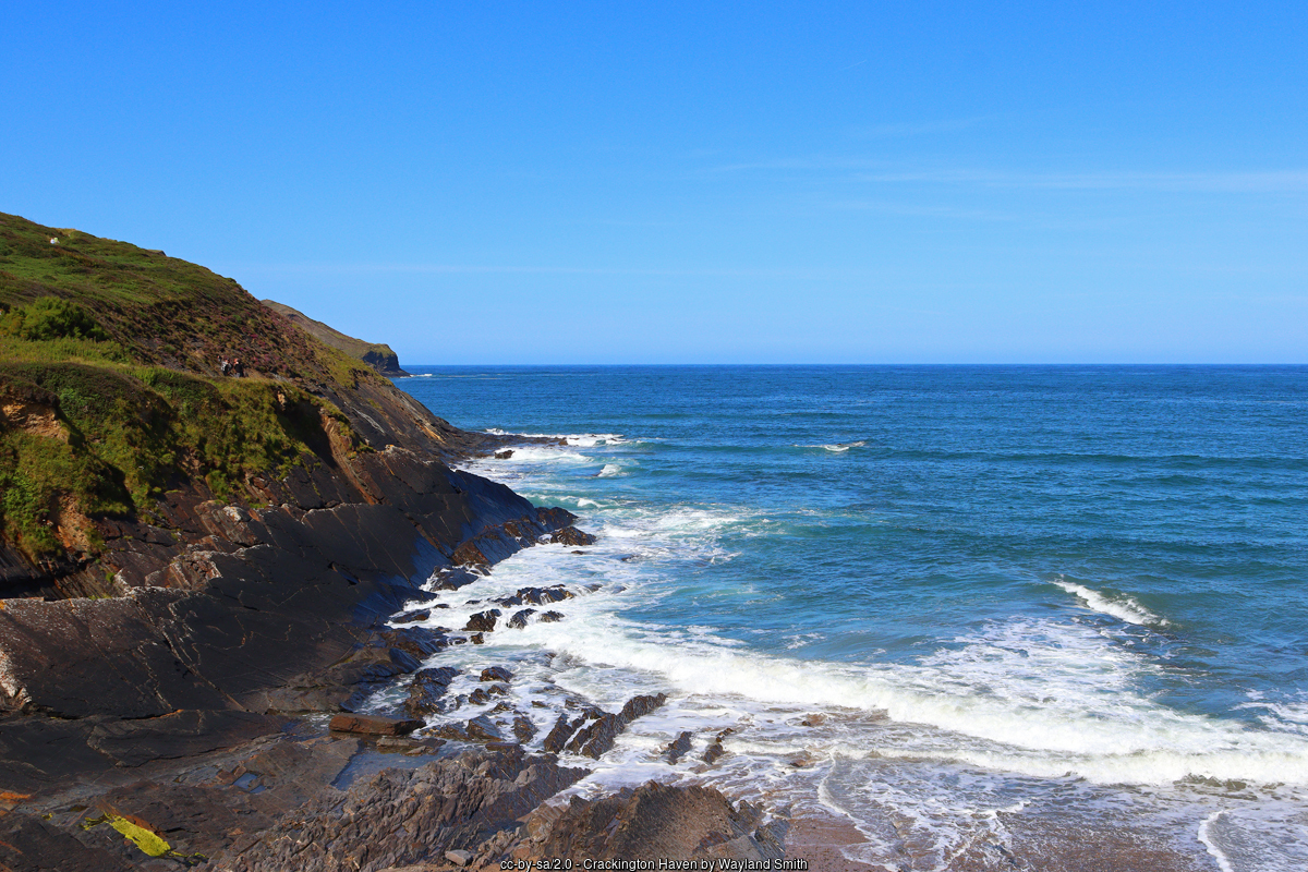 Waves breaking on the rocky shore below the cliffs at Crackington Haven
