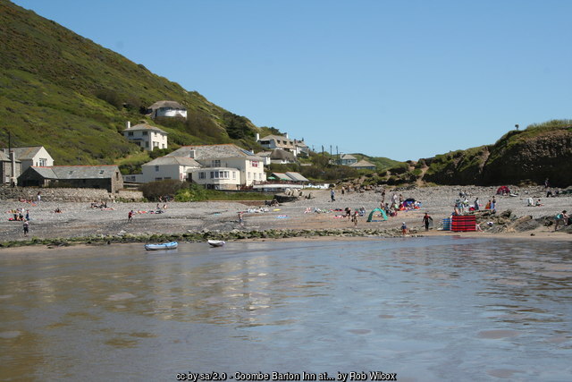 The beach at Crackington Haven looking inland to the Coombe Barton Inn and the valley