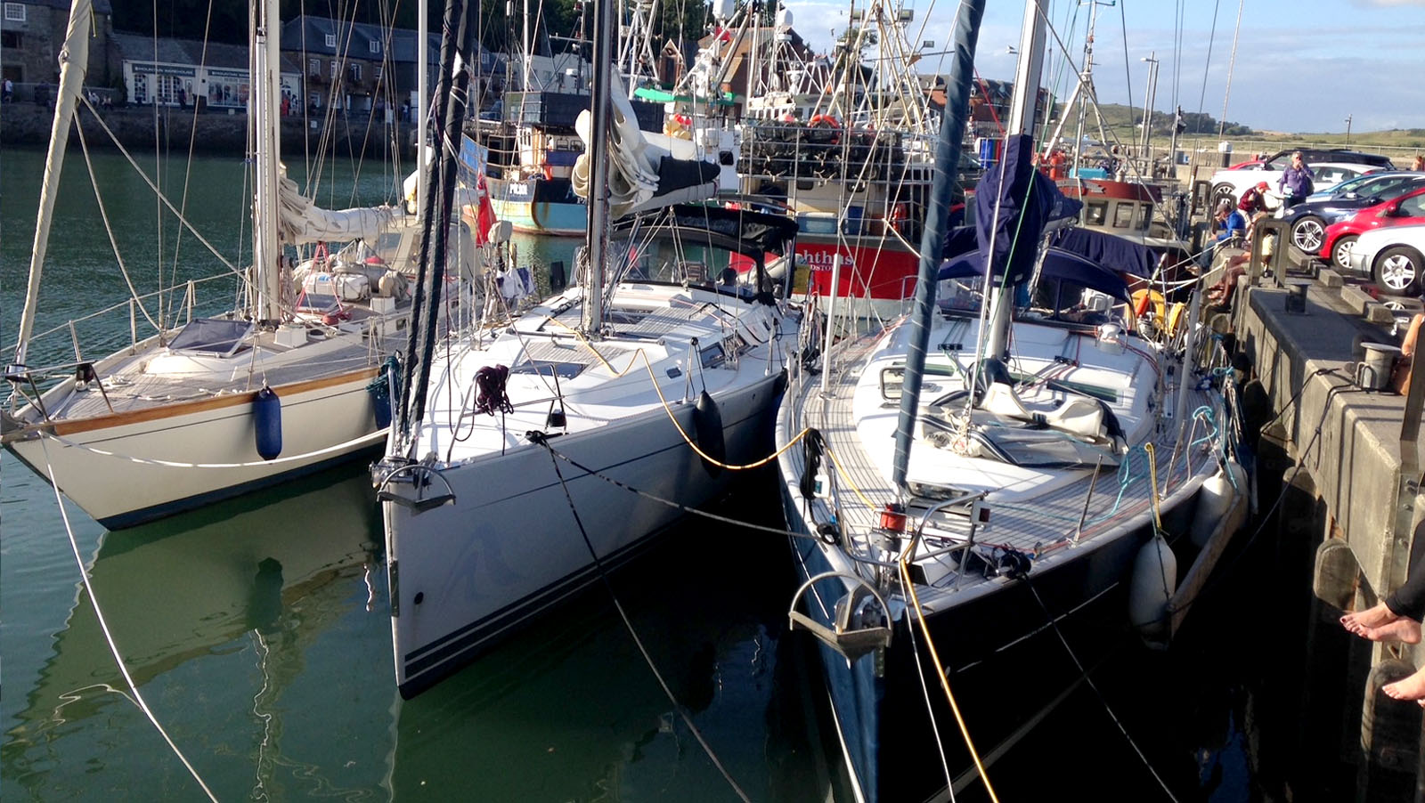 Yachts and visitors on the busy quayside in Padstow