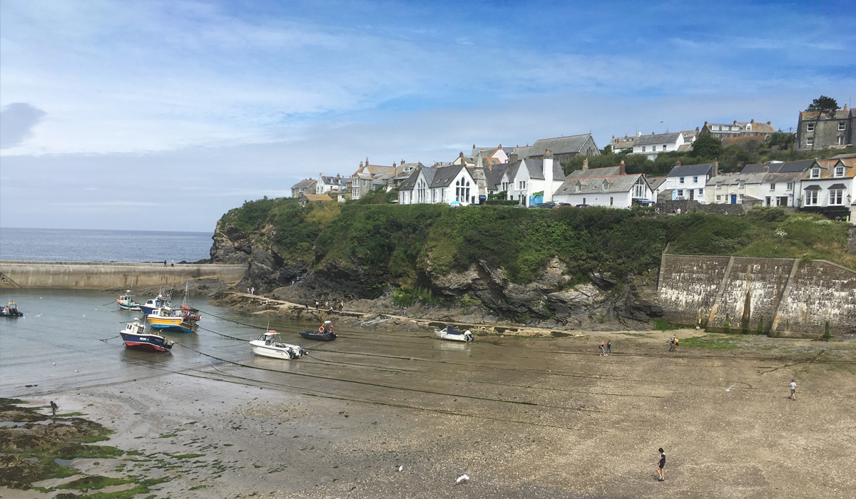 Port Isaac harbour beach and breakwater at low tide
