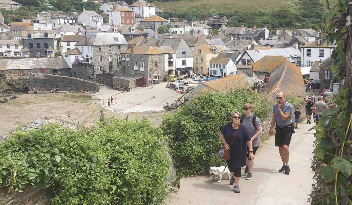 Looking down over Port Isaac&rsquo;s old village and harbour from Roscarrock Hill
