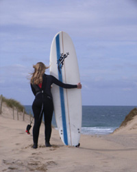 Surfing in Holywell Bay