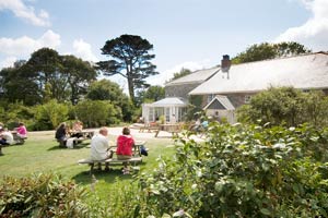 Picnic tables outside Stewards House at the Lost Gardens of Heligan Cornwall