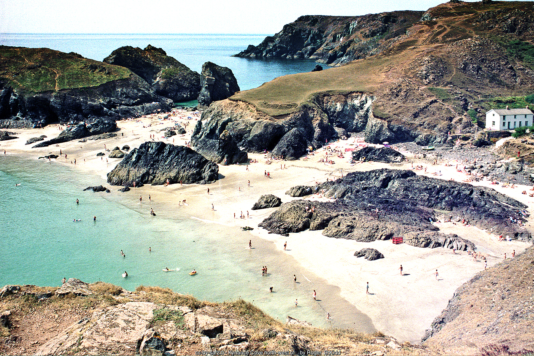 Kynance Cove, a strongly tidal beach where the sea reclaims almost the entire cove, cutting off routes around the rocks and, on the highest tides - Cornwall beach holidays