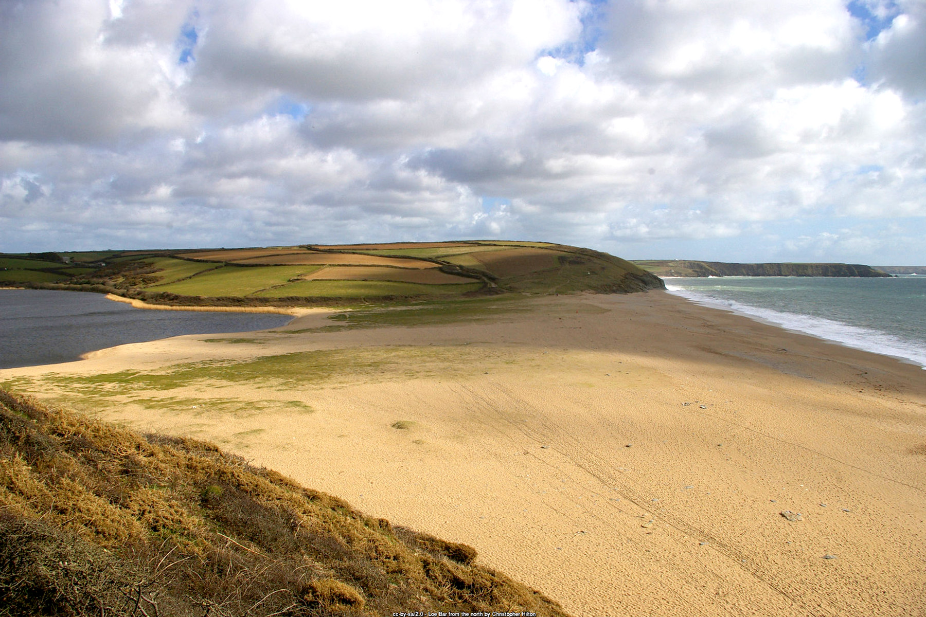 Loe Bar shingle beach near Porthleven Cornwall separating the sea from Loe Pool and Carminowe Creek - Cornwall beach holidays
