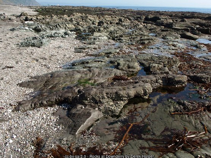 Rock pools and Shag Rock at low tide, Downderry beach, Cornwall