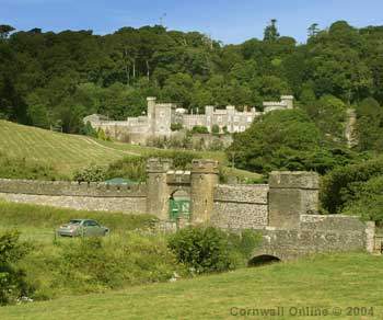 Caerhays Castle and its gatehouse above Porthluney Cove