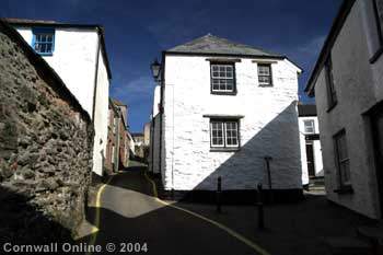 A narrow street of whitewashed cottages in the old village
