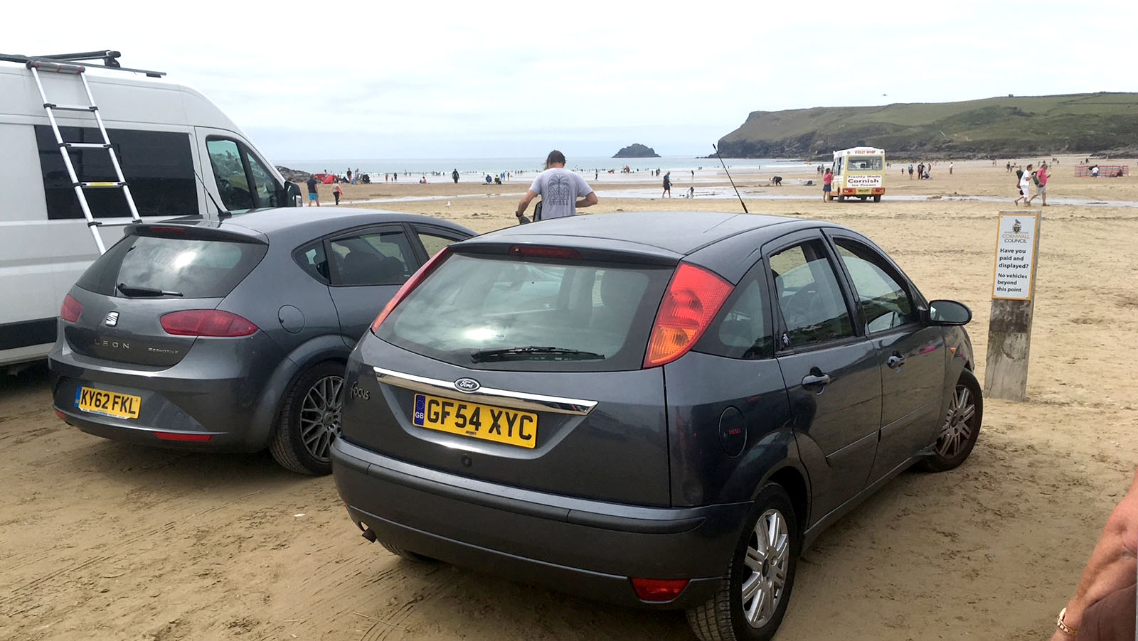 Cars parked on the sand in the Polzeath beach car park