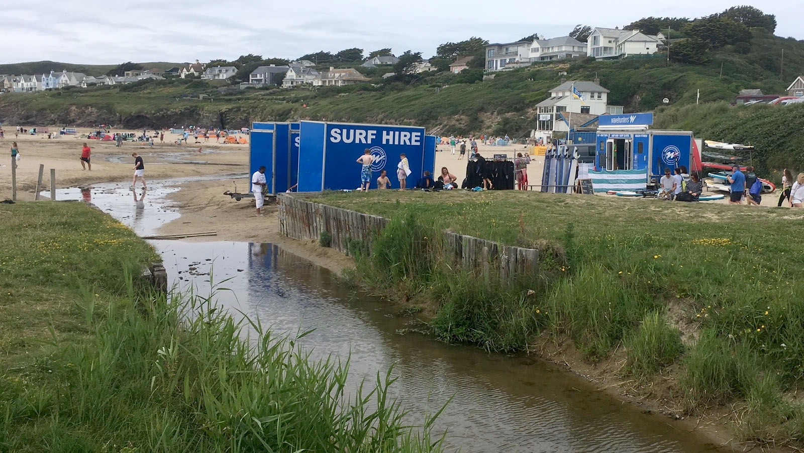 Polzeath Brook flowing across the beach beside the car park