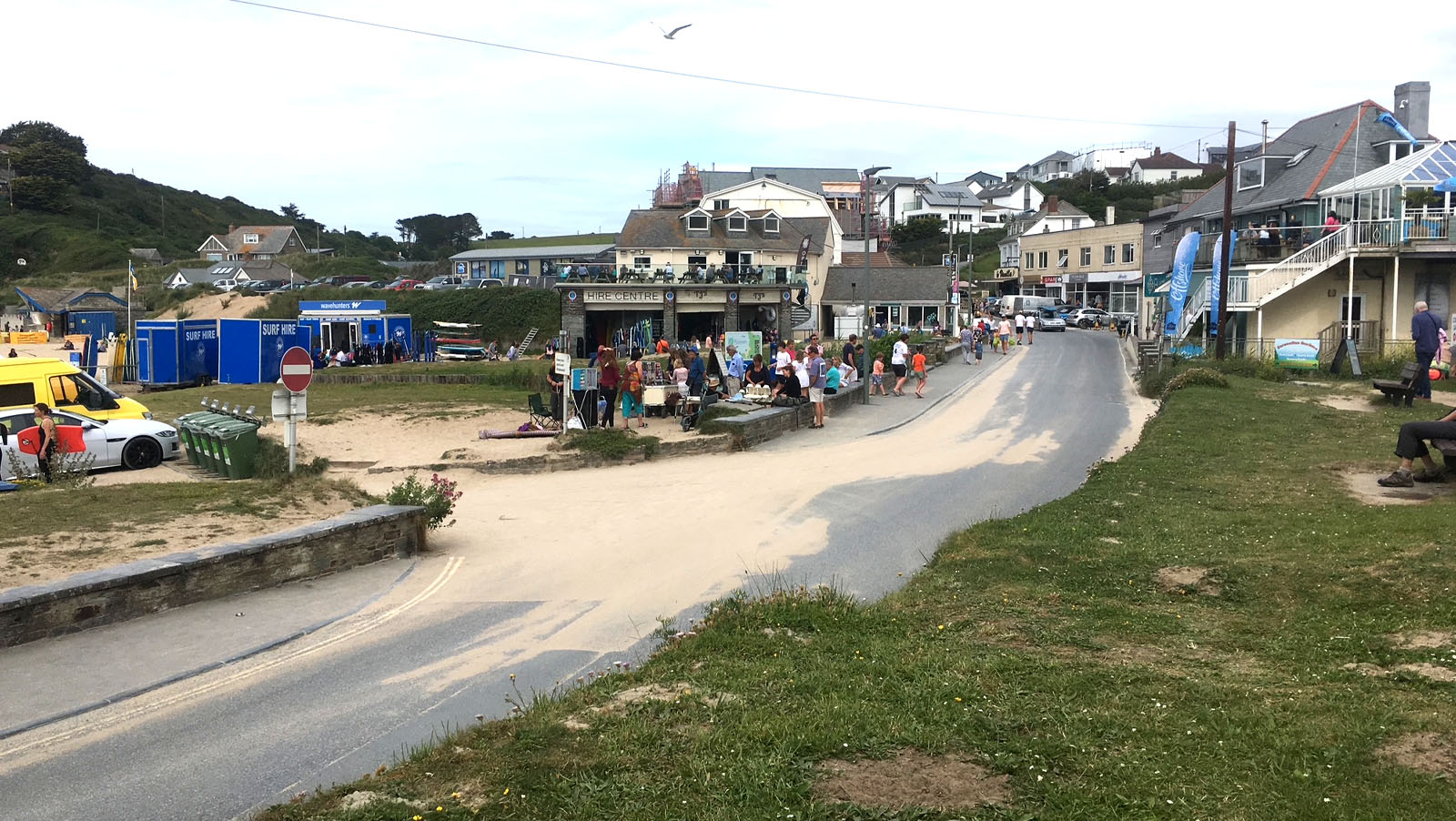 The main beach entrance and busy main street in Polzeath village