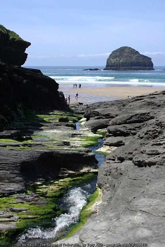 The Trebarwith stream running through the rocks to the beach, with Gull Rock beyond