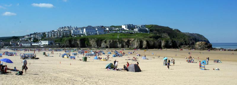 Families enjoying sun, sea and sand on Perranporth beach